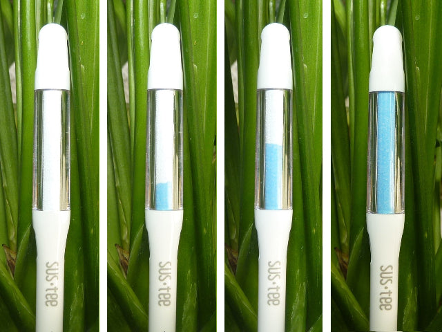 Four SusTee devices with blue and white indicator bands against a green grass background